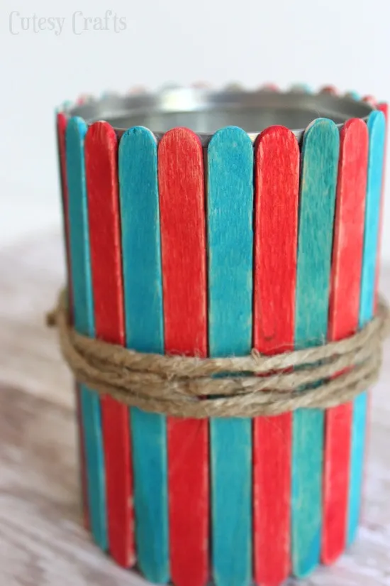 Popsicle Stick Vases - Fun 4th of July craft for the kids!  Use them to hold cut flowers or as utencil holders at your 4th of July party.