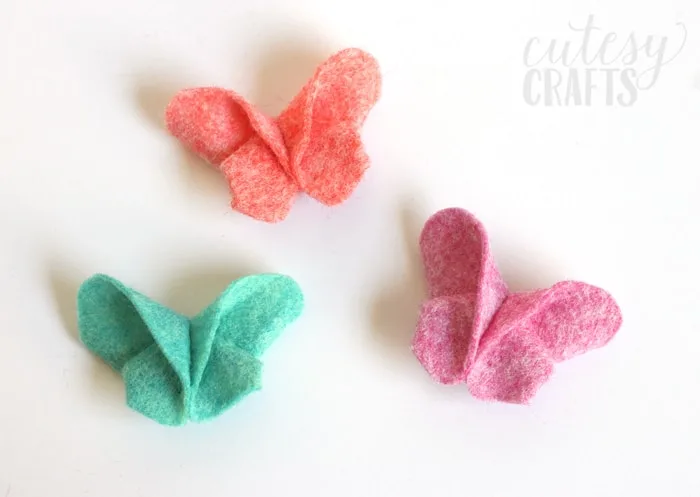 Fold felt like origami to make these adorable felt butterfly hair clips!