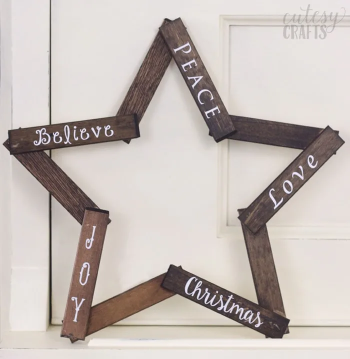 Make this pretty wooden star DIY Christmas decoration for your holiday mantle! It's so easy to make and looks so pretty when it's done!