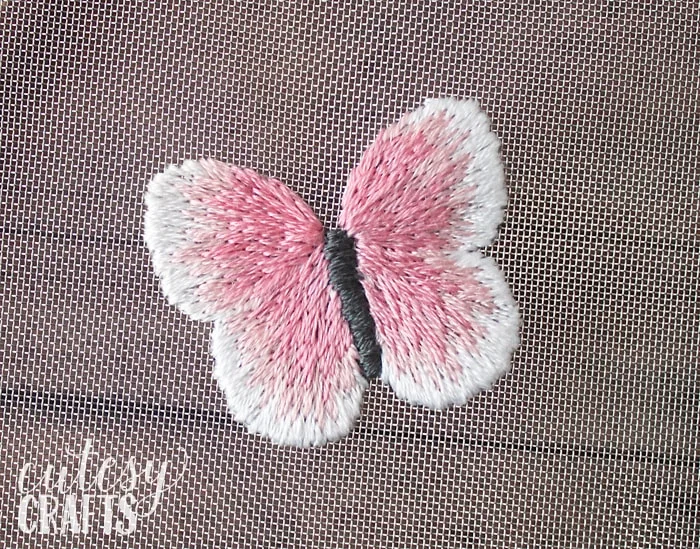 Long and short stitch butterfly on mesh.
