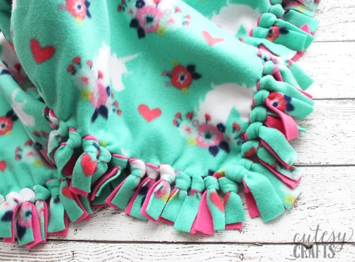 How to Make a Tie Blanket from Fleece - Cutesy Crafts