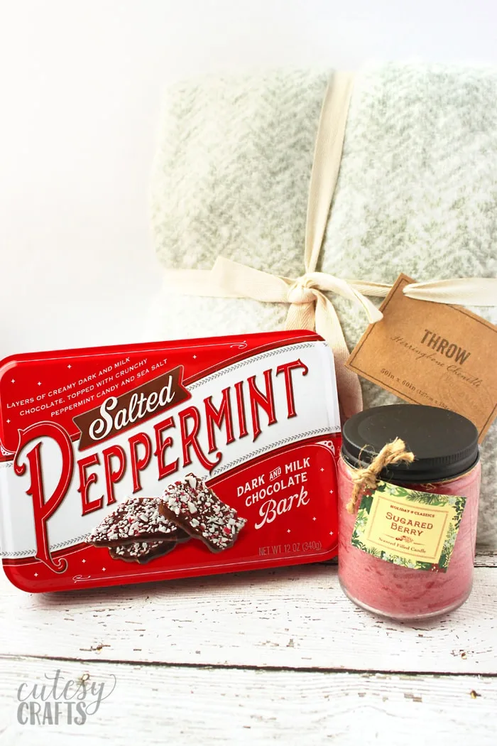 Chenille throw, candle and peppermint bark tin from Cost Plus World Market.