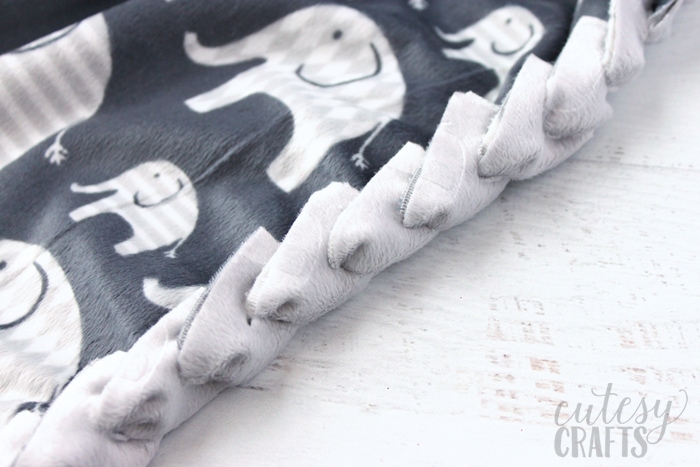 How to make a no-sew baby blanket with a braided edge.