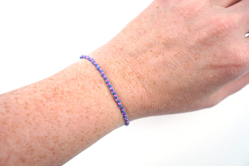 Premium Vector  Vector multicolored handmade hippie friendship bracelet of  violet threads